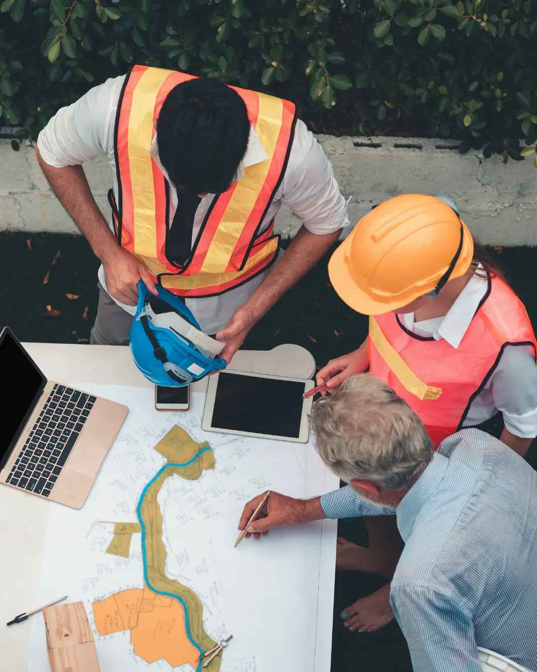 Project management team collaborating on a pharmaceutical facility site