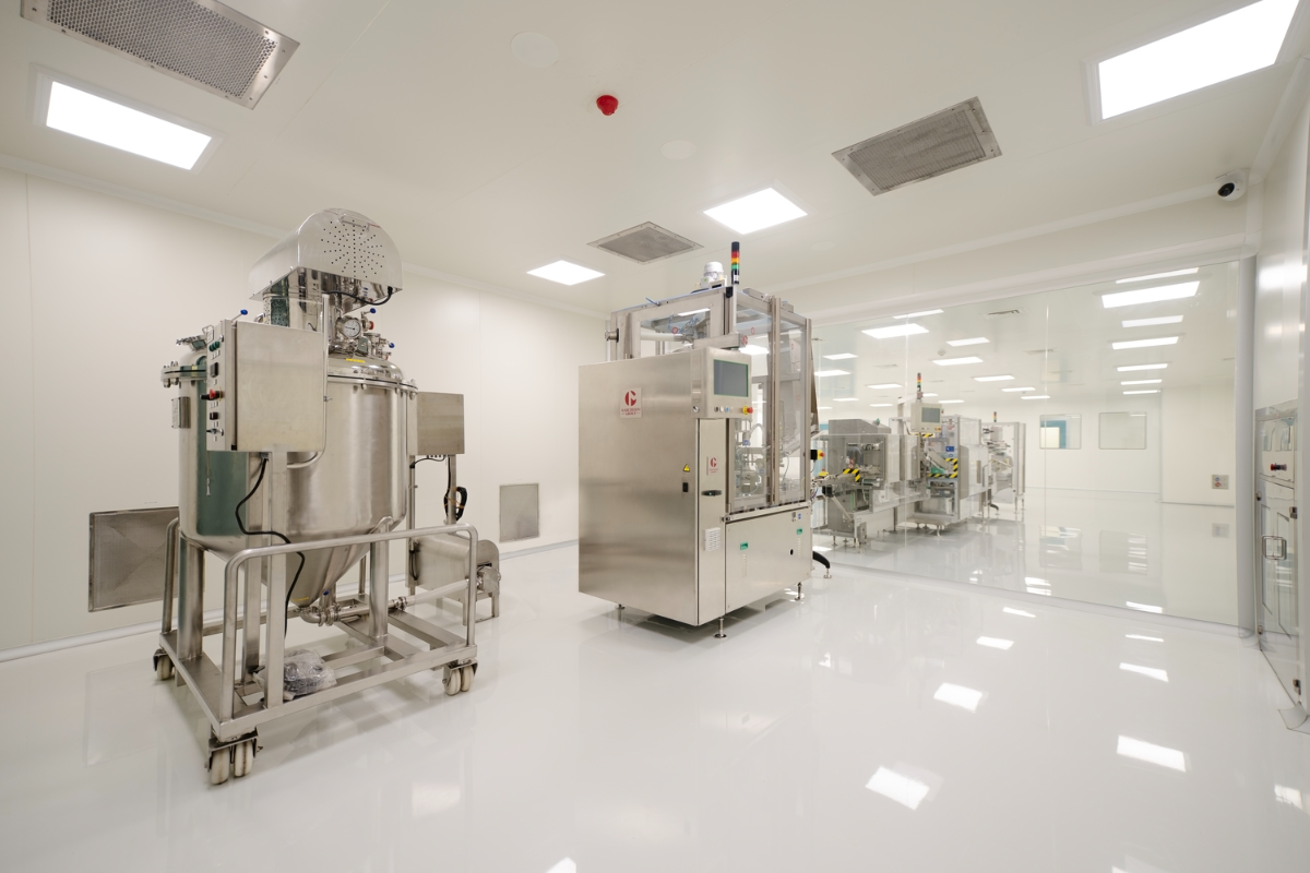 Personnel walking through a graded cleanroom corridor